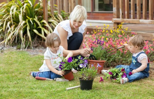 Front view of a gardener inspecting a residential garden near Richmond