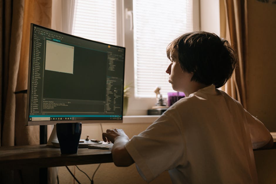A computer screen displaying dense lines of colorful programming code with different syntax highlighting, indicating software development or web coding activity. The code is arranged in a structured m